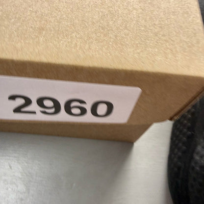 Nike black Air Huarache trainers with metallic silver mini swoosh logo.