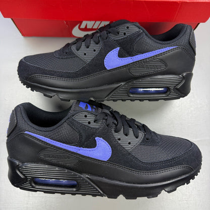 Nike deck shoes black with sapphire accents and signature swoosh logo.