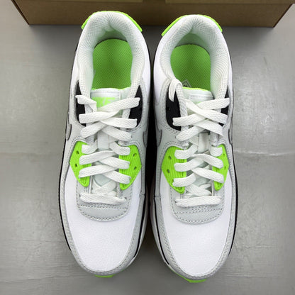 Nike Air Max 90 white trainers with black and lime blast accents, logo on tongue.