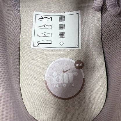 Nike Air Max Pulse purple trainers with unique design and textured material.