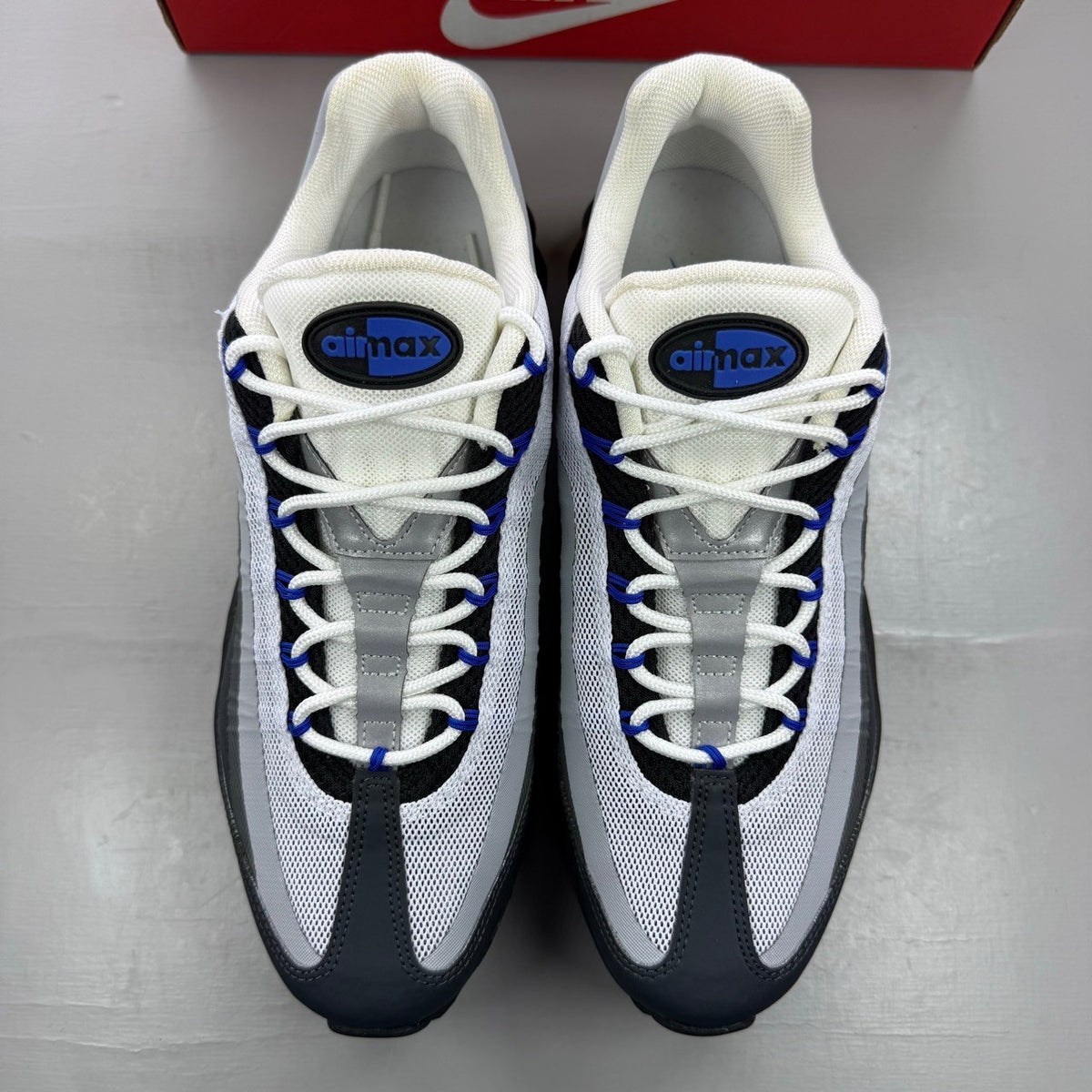 Nike Air Max 95 Ultra black with racer blue and anthracite grey accents, sleek design.