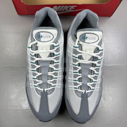 Nike running shoes grey with big bubble sole and reflective detailing.