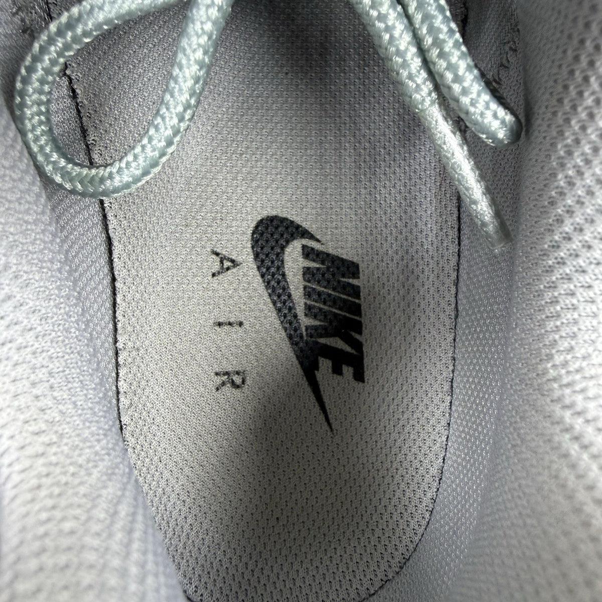 Nike Air Max 95 Ultra grey trainers with white accents and signature logo detailing.