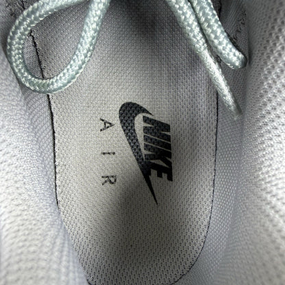 Nike Air Max 95 Ultra grey trainers with white accents and signature logo detailing.