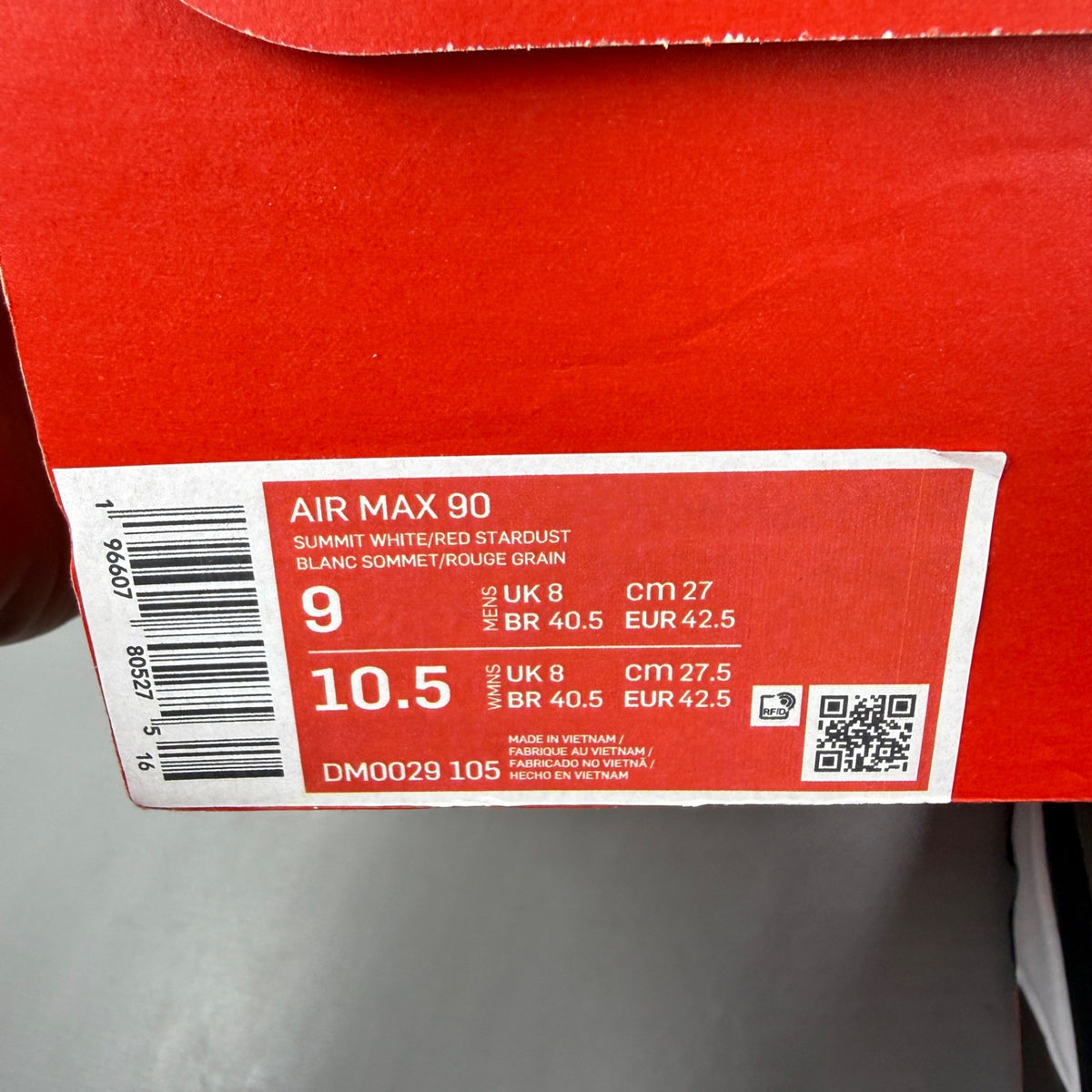 Nike deck shoes red with white accents and logo, featuring a sleek design.