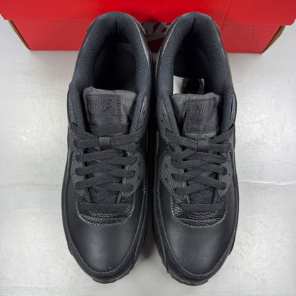 Nike athletic shoes black leather with Air Max branding and textured design.