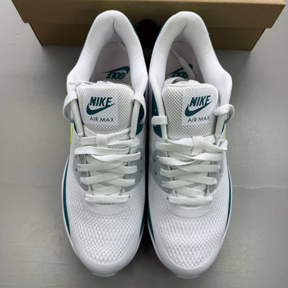 Nike Air Max 90 white golf shoes with bright spruce and volt accents, authentic design.