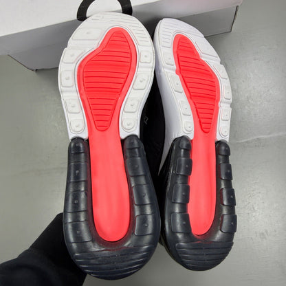 Nike Air Max 270 black trainers with white accents and logo detail.