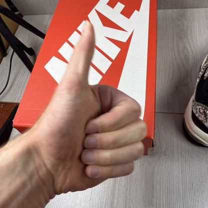 Nike Air Max 98 trainers black with white accents and signature logo detail.