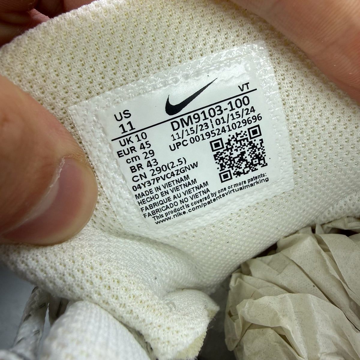 Nike Air Max 95 Ultra white trainers with reflective details and signature logo.