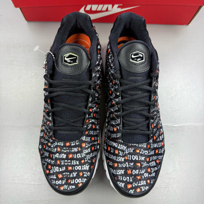 Nike black trainers featuring the Just Do It logo and sleek design.
