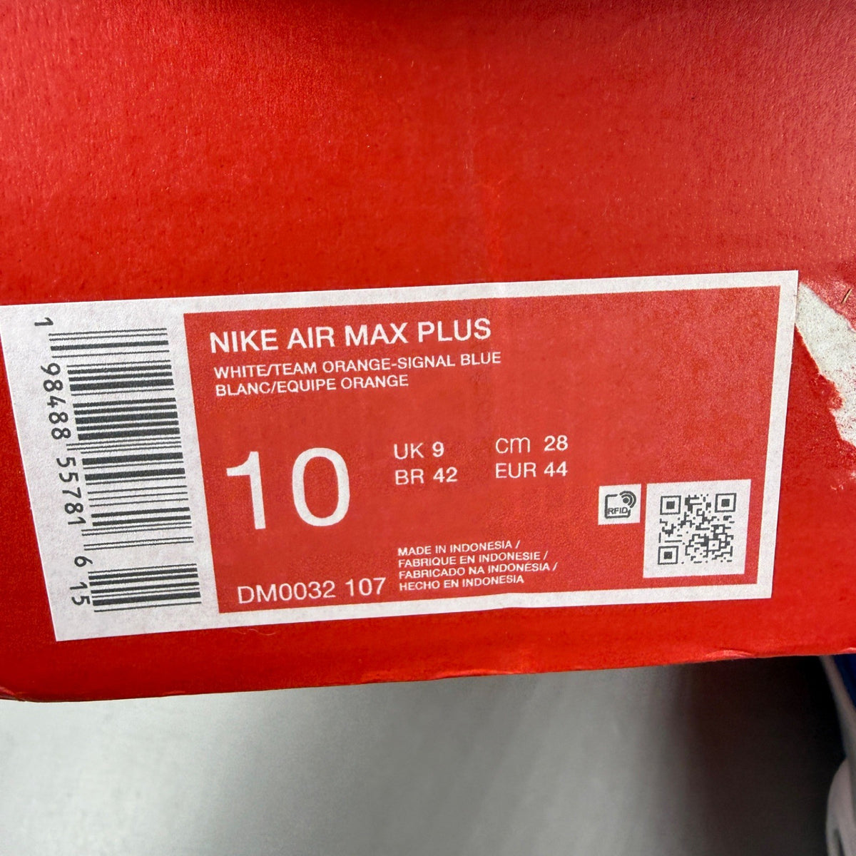 Nike trainers white with signal blue accents and distinctive Air Max Plus design.