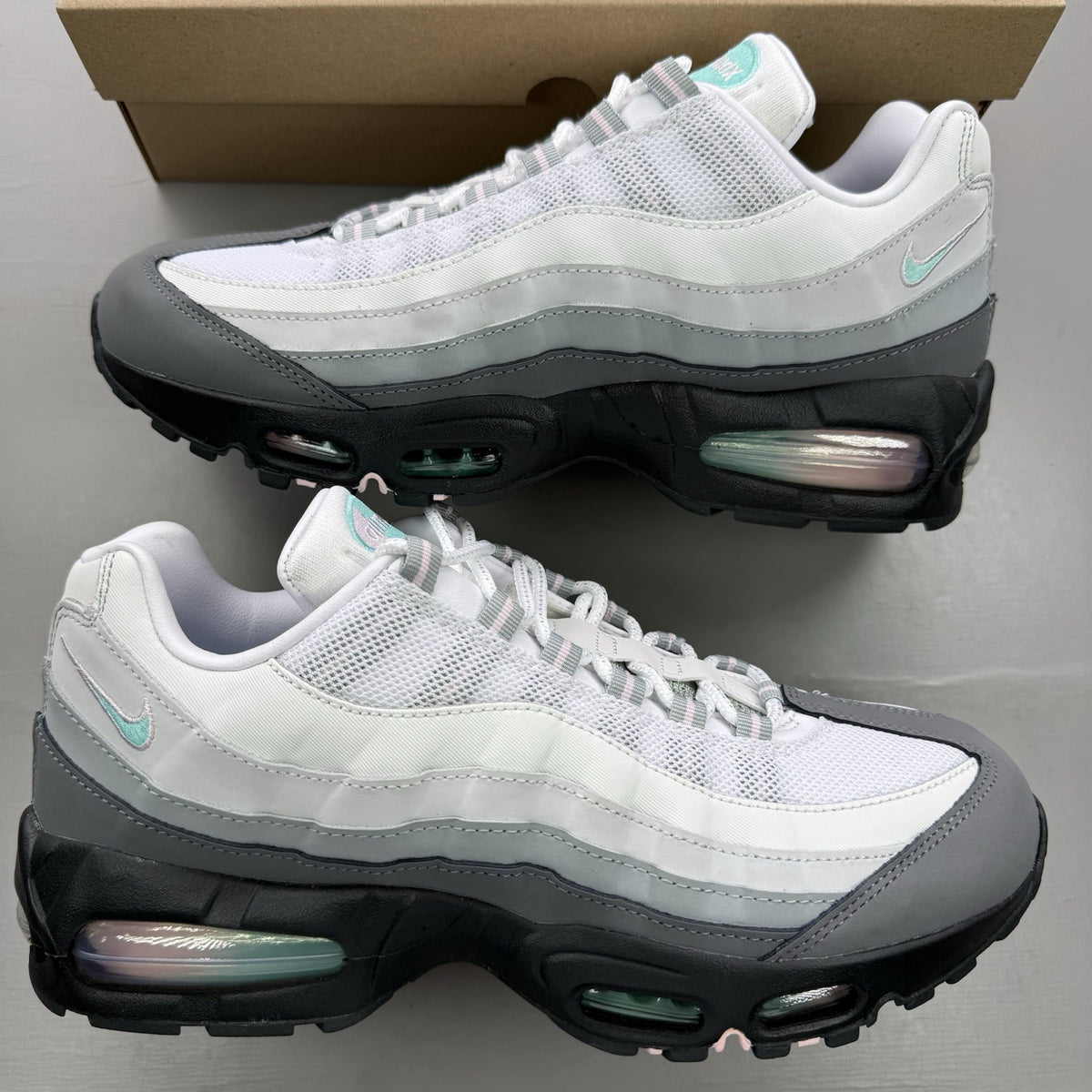 Nike Air Max 95 trainers white with turquoise and pink accents, big bubble design.