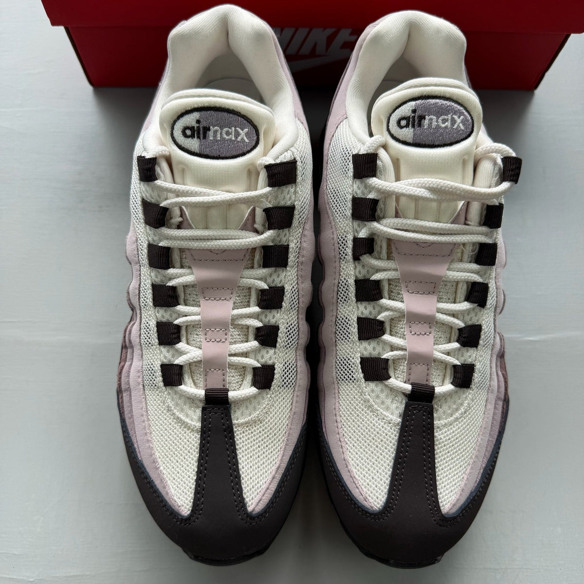 Nike black Air Max 95 trainers with big bubble design and light violet accents.