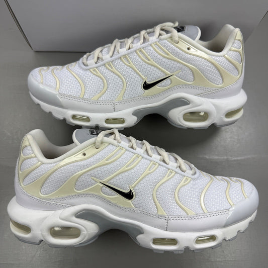 Nike Air Max Plus TN white trainers with cream accents and distinctive TN logo.