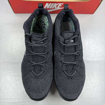 Nike Air VaporMax 2023 black Flyknit sneakers with visible logo and sleek design.