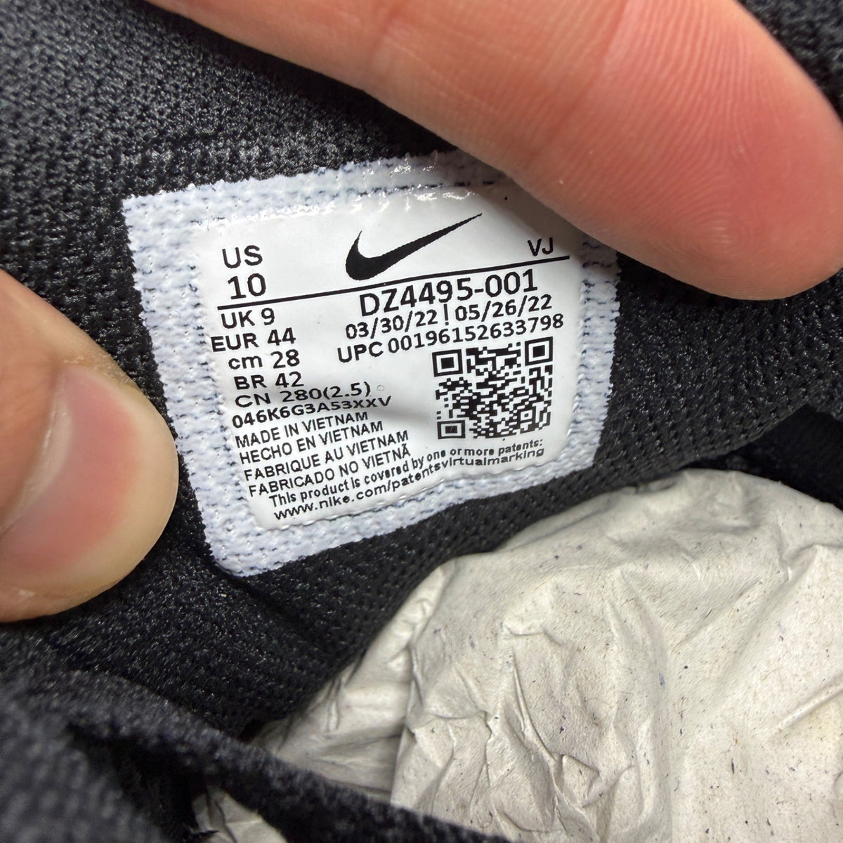 Nike trainers black with neon volt accents and white-grey detailing, featuring iconic logo.