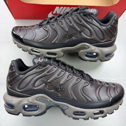 Nike Air Max Plus TN Premium black trainers with signature logo and sleek design.
