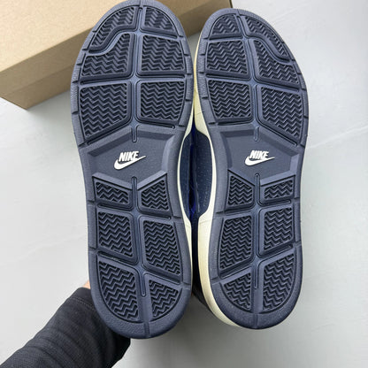 Nike blue trainers with obsidian camo pattern and logo detail.