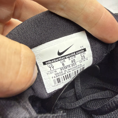 Nike Air Presto black trainers with logo detailing and breathable mesh upper.