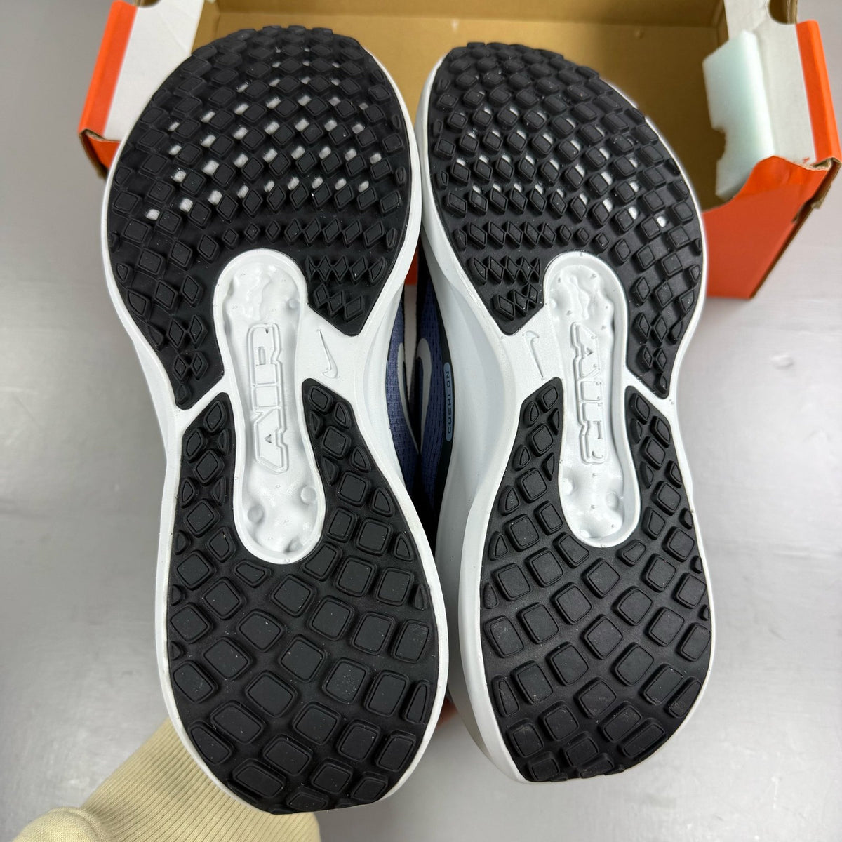 Nike blue trainers with mesh upper and swoosh logo, size UK 6.