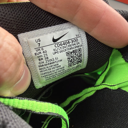 Nike P-6000 trainers black with green and white accents, mesh and synthetic material.