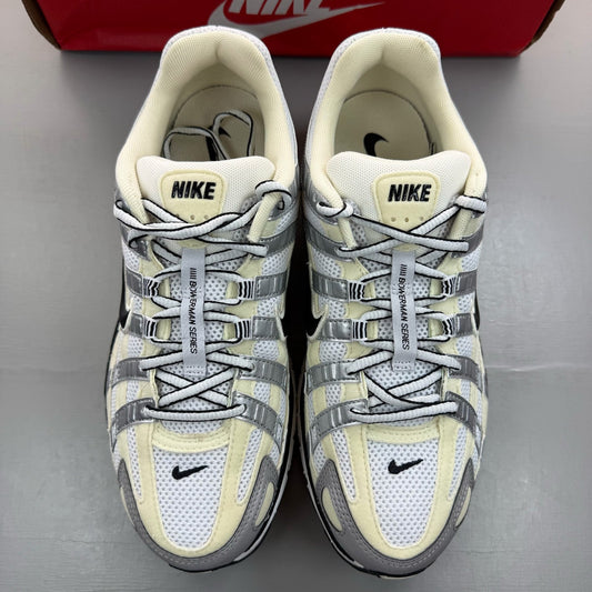 Nike P-6000 white trainers metallic silver accents and mesh detailing.