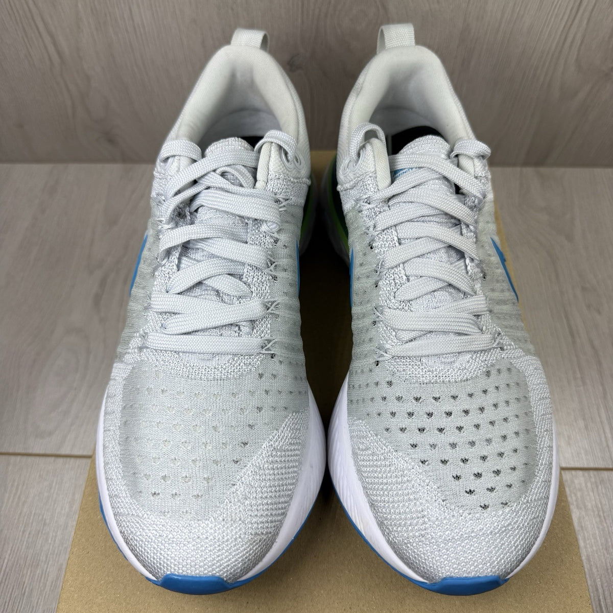 Nike React Infinity Run Flyknit 2 trainers blue grey white with Flyknit upper and logo.