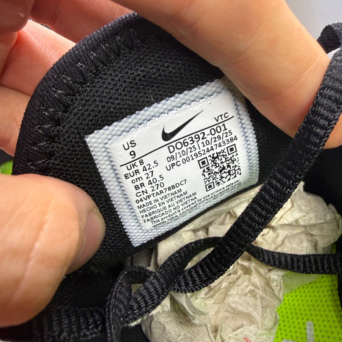 Nike Air Max 270 black trainers with neon volt green accents and white sole.