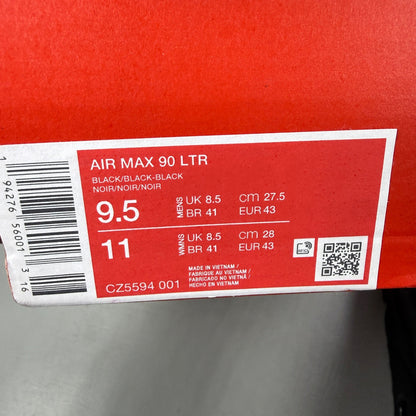 Nike athletic shoes black leather with Air Max branding and textured design.