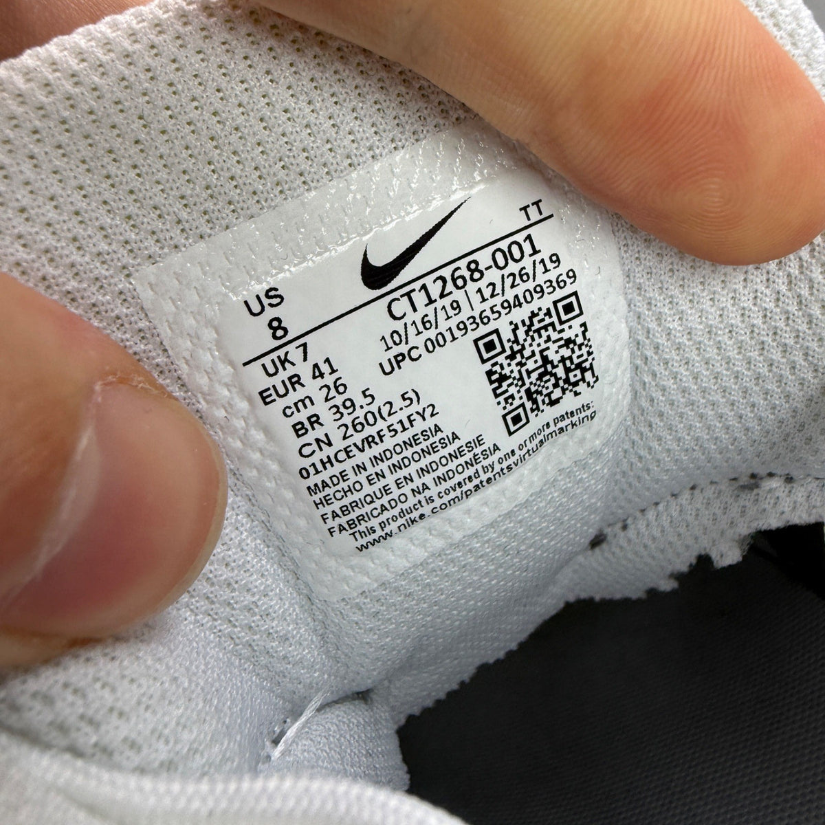Nike Air Max 95 grey sneaker with white accents and reflective detailing.