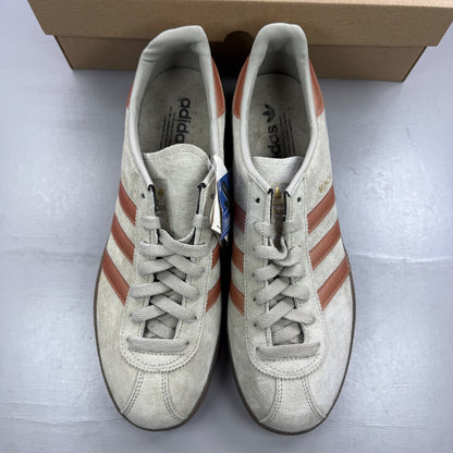 Adidas grey deck shoes with iconic three stripes and textured suede material.