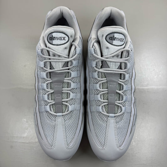 Nike Air Max 95 white trainers with big bubble sole and reflective detailing.