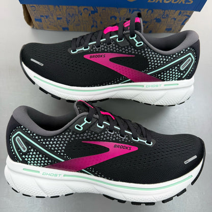 Brooks black trainers with white and pink accents, featuring logo and breathable mesh material.