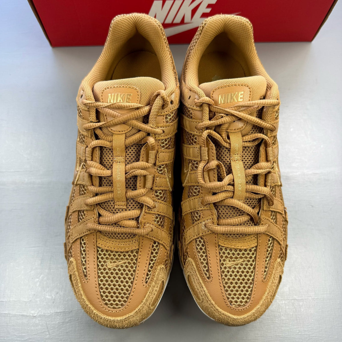 Nike P-6000 SE trainers multi-colour with metallic gold accents and mesh detailing.