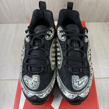 Nike Air Max 98 trainers black with white accents and signature logo detail.