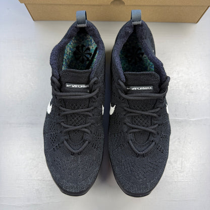 Nike black trainers Flyknit upper with Air cushioning and signature swoosh logo.