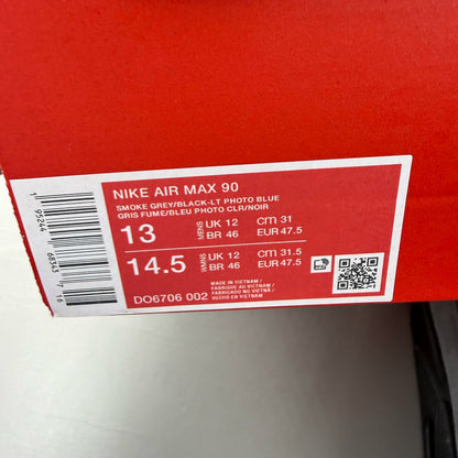 Nike Air Max 90 grey trainers with light blue accents and signature logo.
