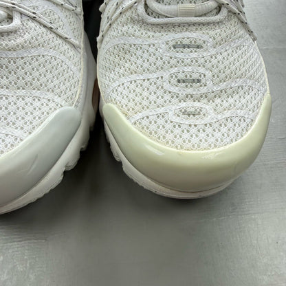 Nike footwear white trainers with orange accents and distinctive Air Max Plus TN design.