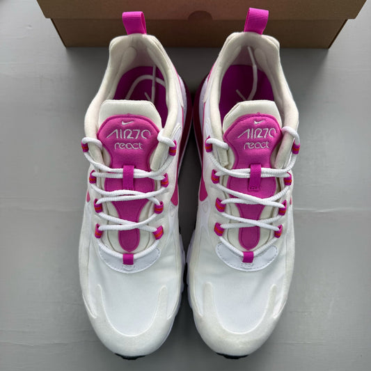 Nike white trainers with fire pink accents and Air Max logo detail.