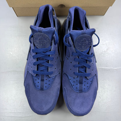 Nike running shoes blue with mesh upper and signature logo detail.