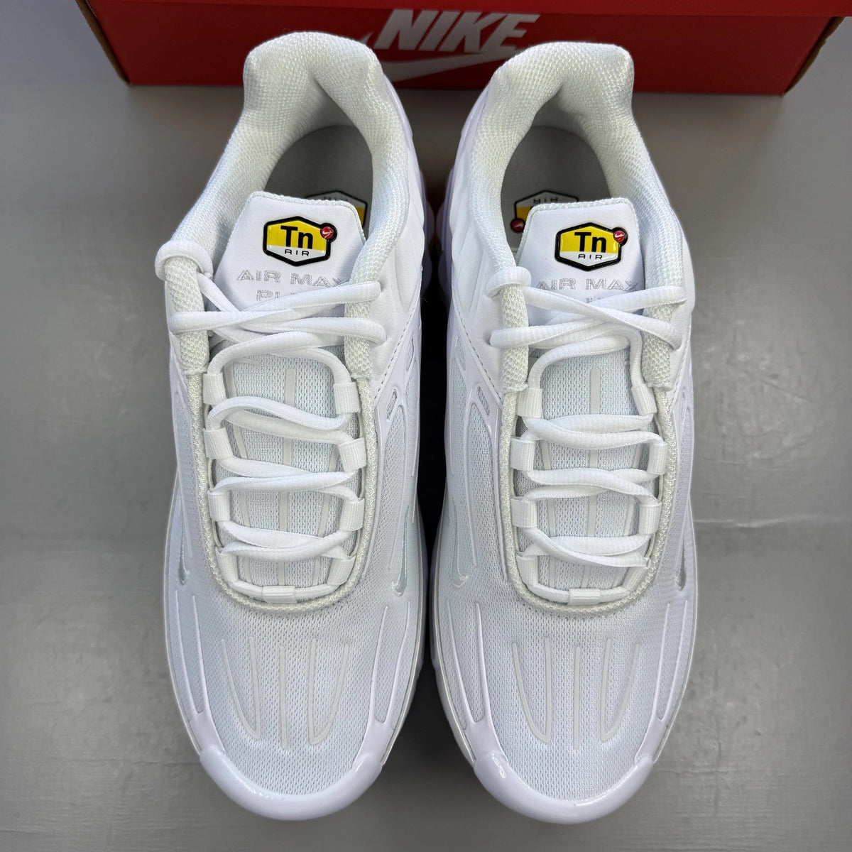 Nike Air Max Plus TN 3 white trainers with logo detailing and mesh upper.