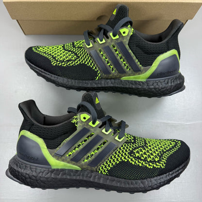 Adidas black Ultraboost 1.0 trainers with Lucid Lemon accents and breathable mesh upper.