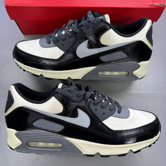 Nike black trainers with crocodile texture and Air Max logo detail.