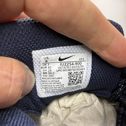 Nike Air Max 95 blue trainers with big bubble sole and branded logo details.