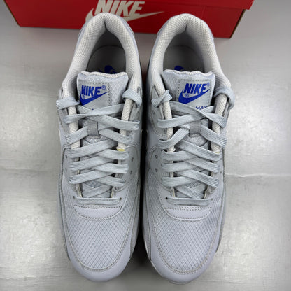 Nike running shoes grey mesh upper with white accents and signature swoosh logo.
