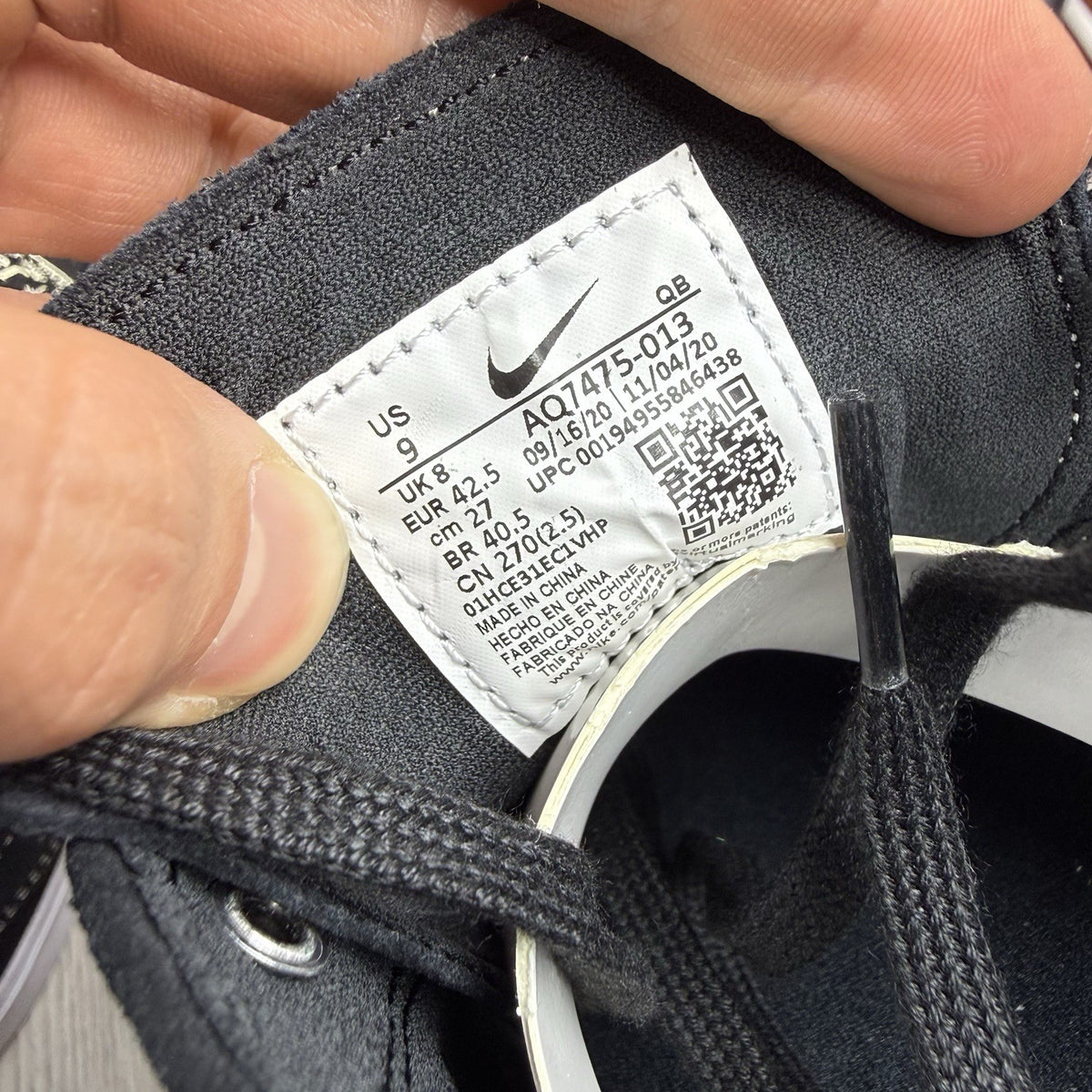 Nike black SB Zoom Stefan Janoski RM sneakers with white logo and sleek design.