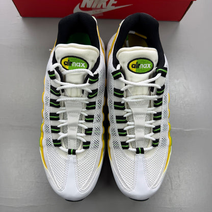 Nike trainers yellow with white accents and green apple details, featuring iconic Air Max design.