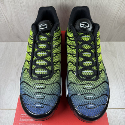 Nike Air Max Plus TN trainers black with racer blue and volt accents, mesh material.