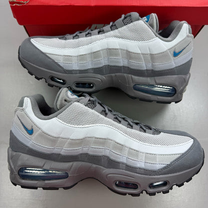 Nike Air Max 95 grey trainers with green accents and signature swoosh logo.